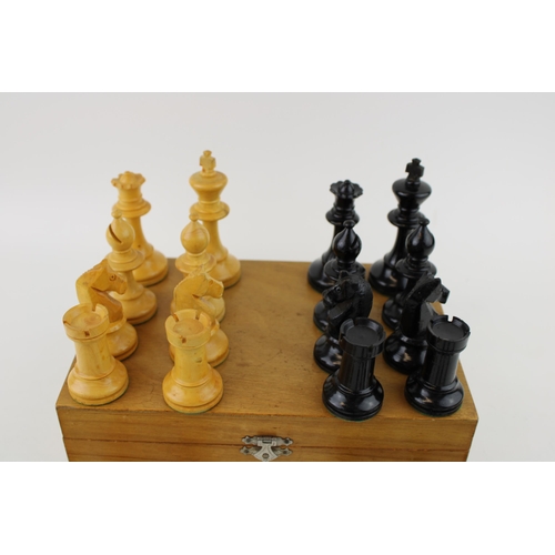 153 - A 20th century wooden chess set, in wooden base, complete, unmarked, box sticker  Schach Zentrale H.... 