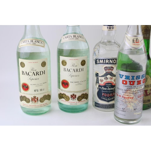 159 - A collection of Bottled Spirits to include Ron Bacardi Superior rum 100cl (2), Smirnoff Vodka, Kumme... 