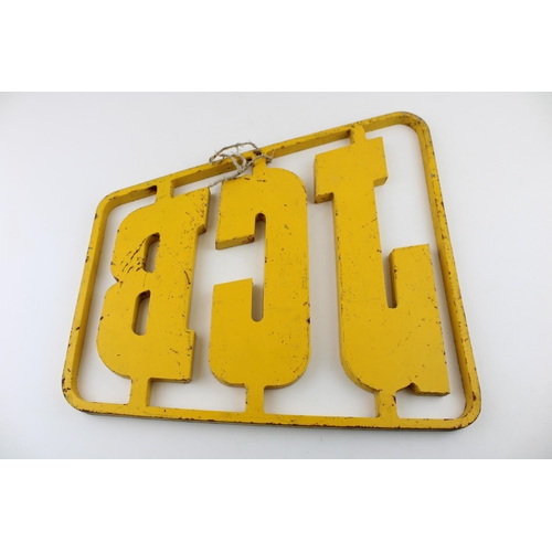 16 - A heavy and large iron advertising sign 'JCB', plasma cut, in yellow paint, 38.5cm wide, from a loca... 