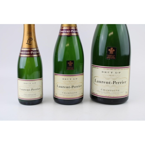 160A - Three vintage Laurent-Perrier Brut Champagne shop display bottles 35cl, 75cl and 1 litre