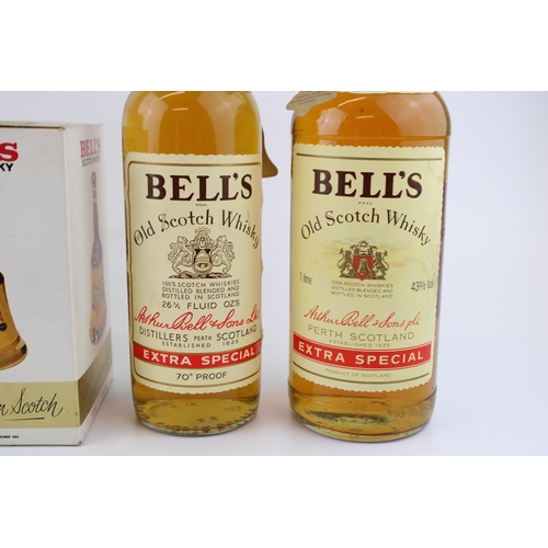 166 - A collection of bottled Bell's Old Scotch Whisky 100cl & 70cl and two Wade Presentation bottles, 18.... 