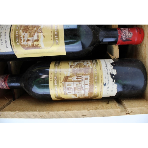 190 - A collection of vintage French wines in a wooden case to include five bottles of Chateau Margaux 197... 