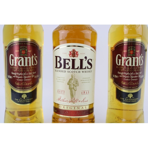 203 - A collection of blended whiskies to include Bell's 1 litre bottle together with two Grant's 70cl bot... 