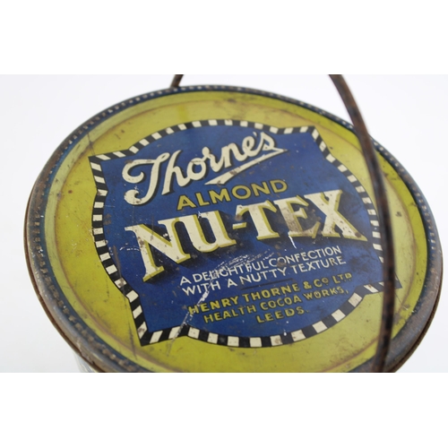 24 - Confectionary tin / pale advertising 'Thorne's Almond Nu-Tex'. Height 16cm.