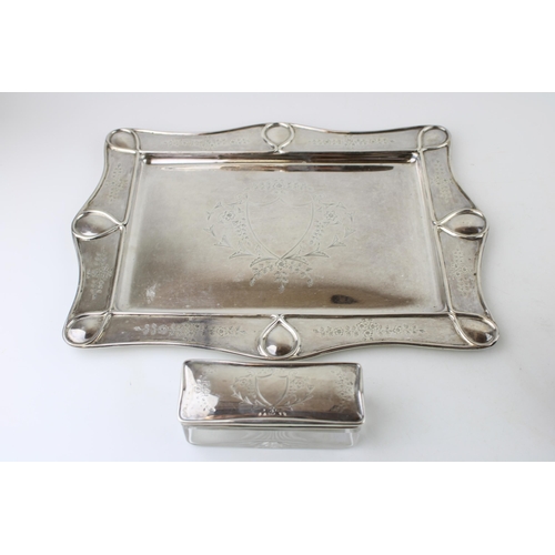 260 - A silver dressing table tray and jar with silver top, both  with bright cut engraved detail, W. G. S... 