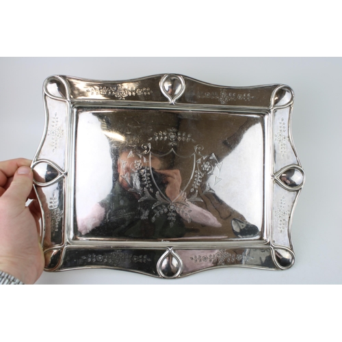 260 - A silver dressing table tray and jar with silver top, both  with bright cut engraved detail, W. G. S... 