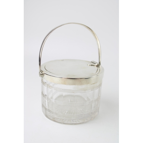 262 - Silver and glass preserve pot, lid opens with handle movement, Birmingham 1908, Heath and Middleton,... 