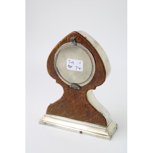 267 - Silver Art Nouveau mantel clock, wooden back, with key, Birmingham 1912, J D W D, 11.5cm tall.