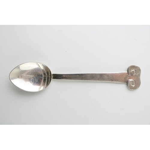 269 - Silver Arts & Crafts table spoon, London 1994, J O Craven, 12.5cm long, tribal face to bowl, 24.3g.