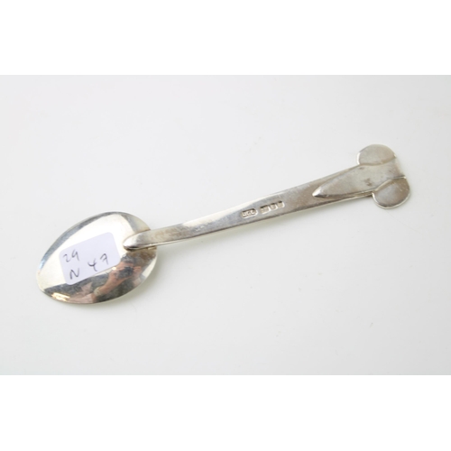 269 - Silver Arts & Crafts table spoon, London 1994, J O Craven, 12.5cm long, tribal face to bowl, 24.3g.