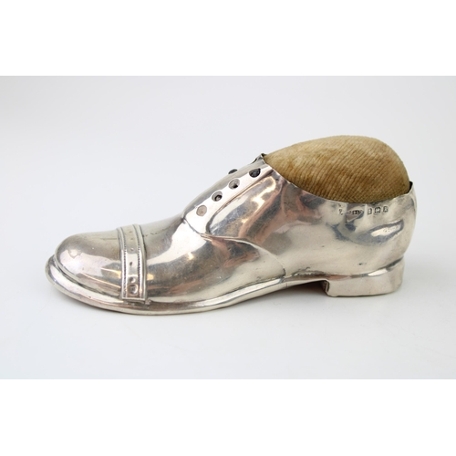 273 - Large hallmarked silver novelty pin cushion in the form of a shoe, Birmingham 1909, 12.5cm long.