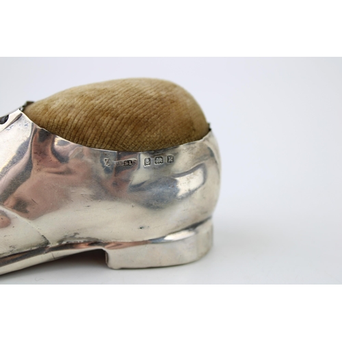 273 - Large hallmarked silver novelty pin cushion in the form of a shoe, Birmingham 1909, 12.5cm long.