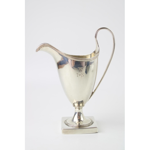 274 - A George III Peter and Anne Bateman silver cream jug, of helmet form, with reeded edge on square ped... 