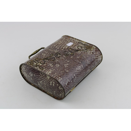 3 - An early 20th century Huntley & Palmer, Art Nouveau faux shagreen tin biscuit tin in the form of a h... 