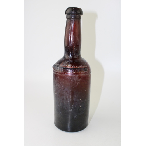 34 - c19th Georgian period amber glass bottle with shoulder ribbon seal Petters c1820