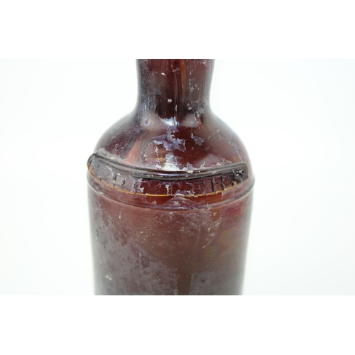 34 - c19th Georgian period amber glass bottle with shoulder ribbon seal Petters c1820