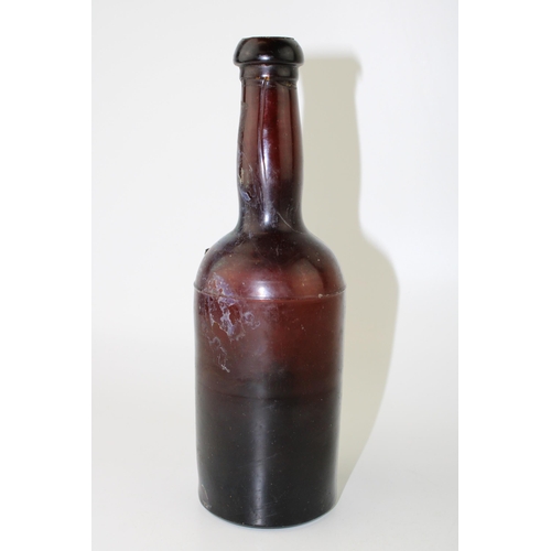 34 - c19th Georgian period amber glass bottle with shoulder ribbon seal Petters c1820