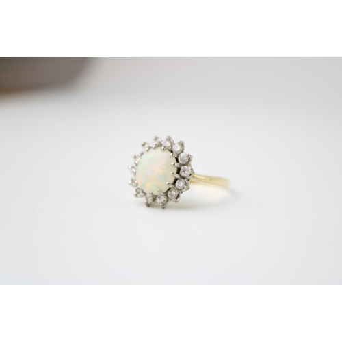 342 - An 18ct gold, opal and diamond dress ring, the single circular opal cabochon of approximately 10mm d... 