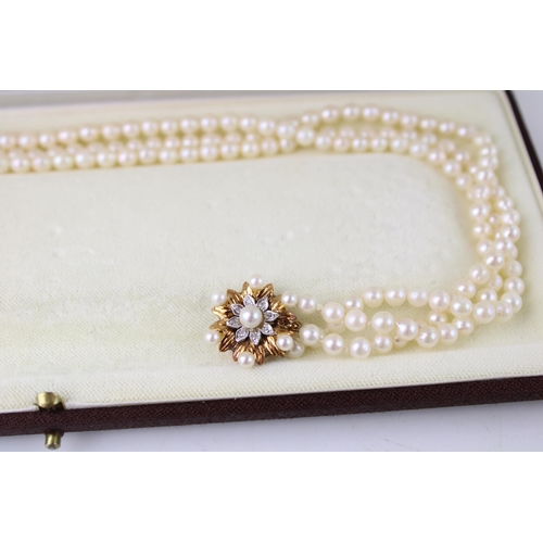 357 - A three strand pearl chocker with 9ct gold, diamond and pearl set clasp of starburst form, total wei... 