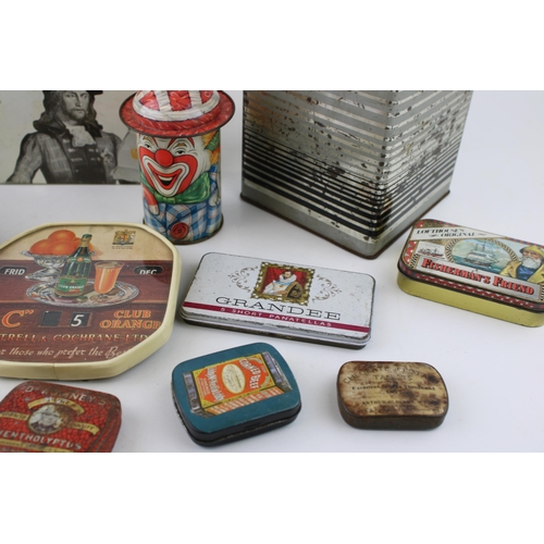 40B - A collection of advertising tins to include examples by 'Huntley & Palmers', 'Cap-Tins' clown tin, a... 