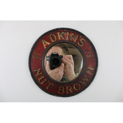 41 - An early twentieth century point of sale 'Adkin's' 'Nut Brown' advertising mirror on tin. Diameter 2... 