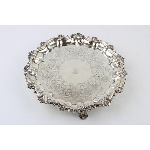 292 - A George III silver salver with bright cut floral engraving, and chased and repousse rococo border, ... 