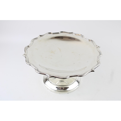 294 - An Edwardian silver pedestal cake stand, with scalloped reeded edge, on simple stepped circular base... 