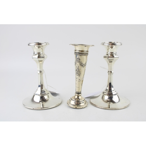 297 - A pair of early 20th century silver candlesticks in the Queen Anne style, Henry Manton, Birmingham 1... 