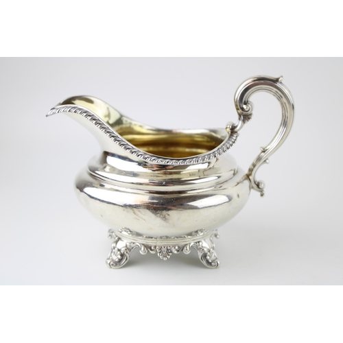 298 - A William IV silver cream jug, with gilt interior, presentation engraved, Edward, Edward junior, Joh... 