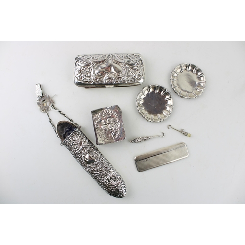 299 - A group of silver items comprising a Victorian spectacles case with chatalaine belt clip and fob, a ... 