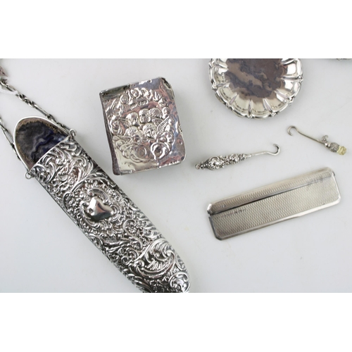 299 - A group of silver items comprising a Victorian spectacles case with chatalaine belt clip and fob, a ... 