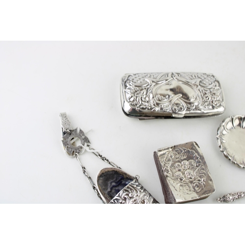 299 - A group of silver items comprising a Victorian spectacles case with chatalaine belt clip and fob, a ... 