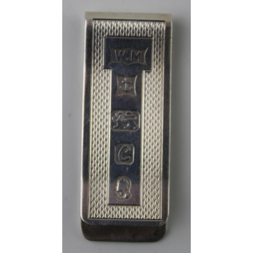 307 - Hallmarked silver money clip, engineered decoration, 16.6g, Birmingham 1977.