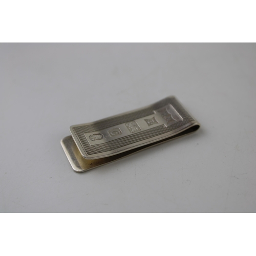 307 - Hallmarked silver money clip, engineered decoration, 16.6g, Birmingham 1977.