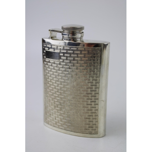 312 - Silver hip flask with engine turned decoration. Weight 151g.