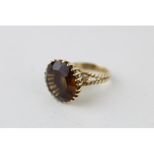 333 - A 9ct gold and smoky quartz dress ring, size L, 9.7g.