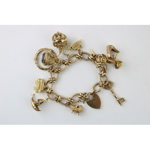 339 - A 9ct gold charm bracelet, the oval links with textured twist and having heart shaped padlock clasp,... 