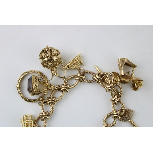 339 - A 9ct gold charm bracelet, the oval links with textured twist and having heart shaped padlock clasp,... 