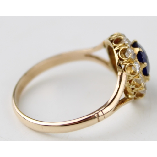 341 - A 9ct gold diamond and sapphire dress ring, the oval cut sapphire of approximately 7 by 6.5mm, surro... 