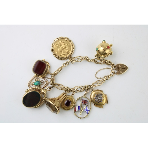 344 - A 9ct gold Celtic weave charm bracelet, with heart shaped padlock clasp and nine various charms incl... 