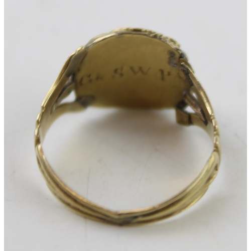 345 - A 19th century mourning ring, tests as 9ct gold or better, inset with a garnet and monogram engraved... 