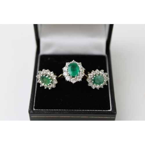 349 - An 18ct gold, diamond and emerald dress ring, the oval cut emerald of approximately 8.2 by 6.4mm, su... 