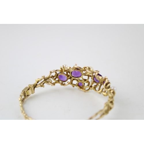 352 - A 9ct gold amethyst and pearl bangle set with five amethysts and four pearls in an organic scrolling... 