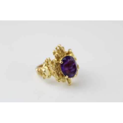 353 - A 9ct gold and amethyst ring of brutalist form circa 1970, the oval cut amethyst of approximately 12... 