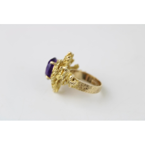 353 - A 9ct gold and amethyst ring of brutalist form circa 1970, the oval cut amethyst of approximately 12... 