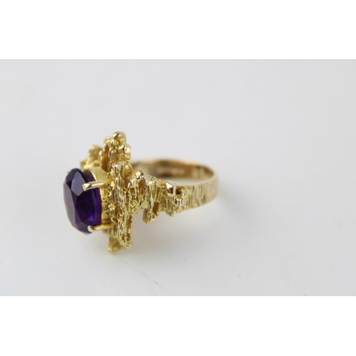 353 - A 9ct gold and amethyst ring of brutalist form circa 1970, the oval cut amethyst of approximately 12... 