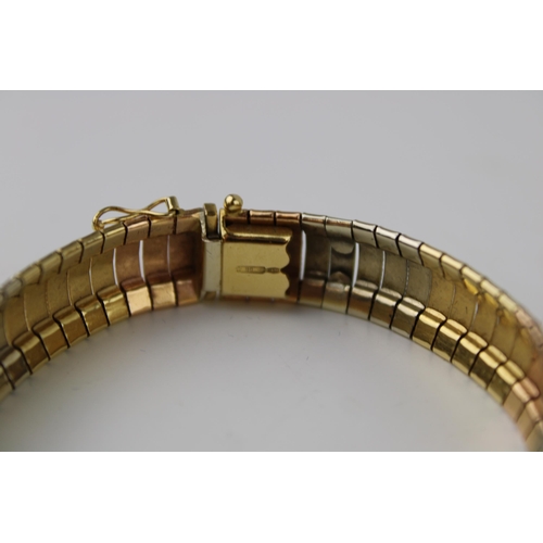 355 - An 18ct tri-colour gold bracelet of textured and engraved reticulated link form, pinch clasp with sa... 