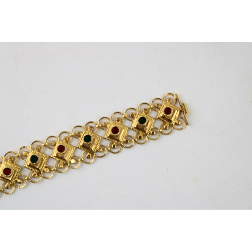 377 - Yellow metal (XRF tests as 18ct gold or better) bracelet, fancy links, enamelled coloured decoration... 