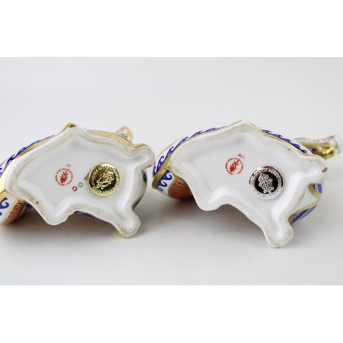 122 - A pair of A Royal Crown Derby Dragon paperweights, decorated in the Imari pallet, one with a gold st... 