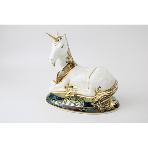 Royal Crown Derby paperweight, Unicorn, 13cm high, specially designed to celebrate the New Millennium, this is number 29 of a  limited edition of 2,000, hand signed in gold by Louise Adams and  dated 23/7/1999, red printed marks and stamp to the base, gold stopper.